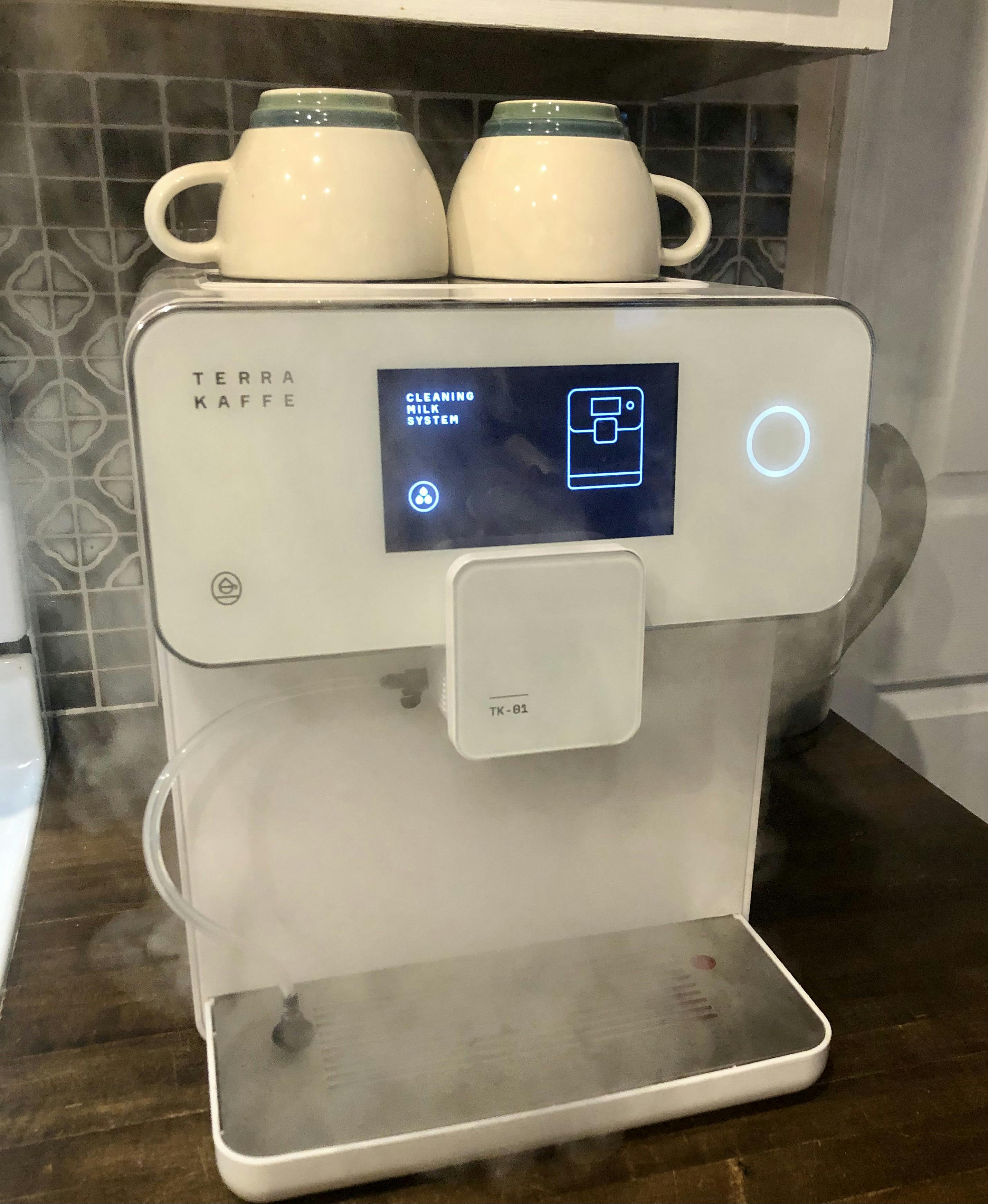 The Terra Kaffe TK-01 Espresso Machine cleaning its milk system.