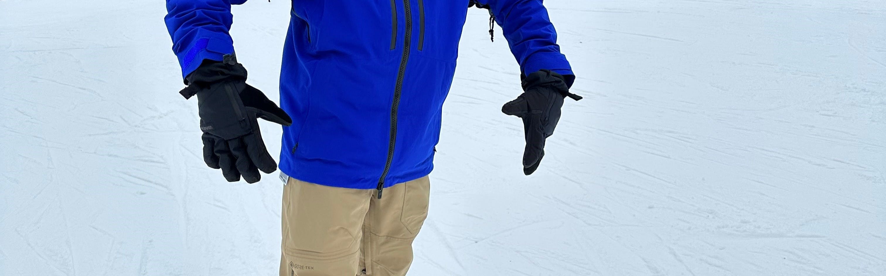 A snowboarder wearing the Dakine Men's Leather Titan GORE-TEX Gloves.