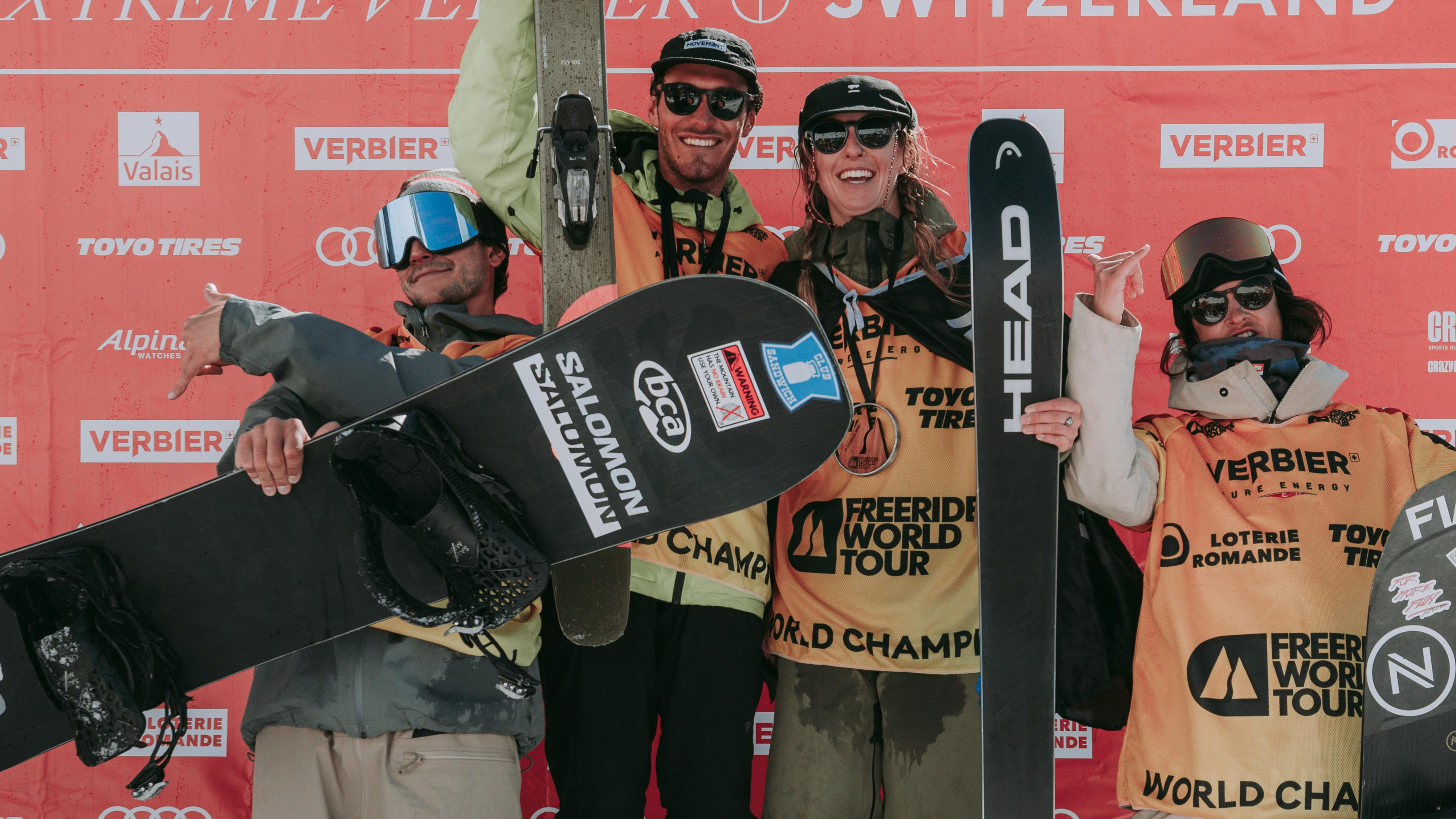 The winning male and female skiers and snowboarders stand on the 2022 Freeride World Tour podium.