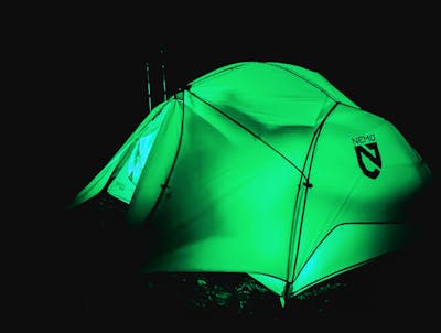 The Nemo Dagger Osmo Tent lit up green in the dark.