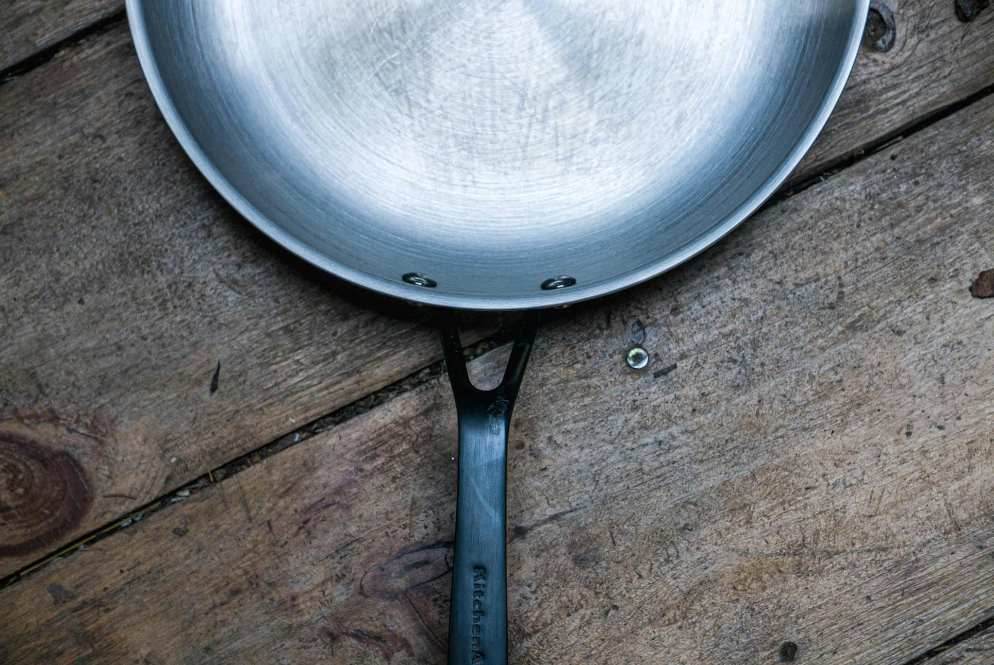 The KitchenAid 5-Ply Clad Stainless Steel Induction Frying Pan, 12.25-Inch, Polished Stainless Steel. 
