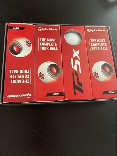 The TaylorMade TP5x golf balls in sleeves.