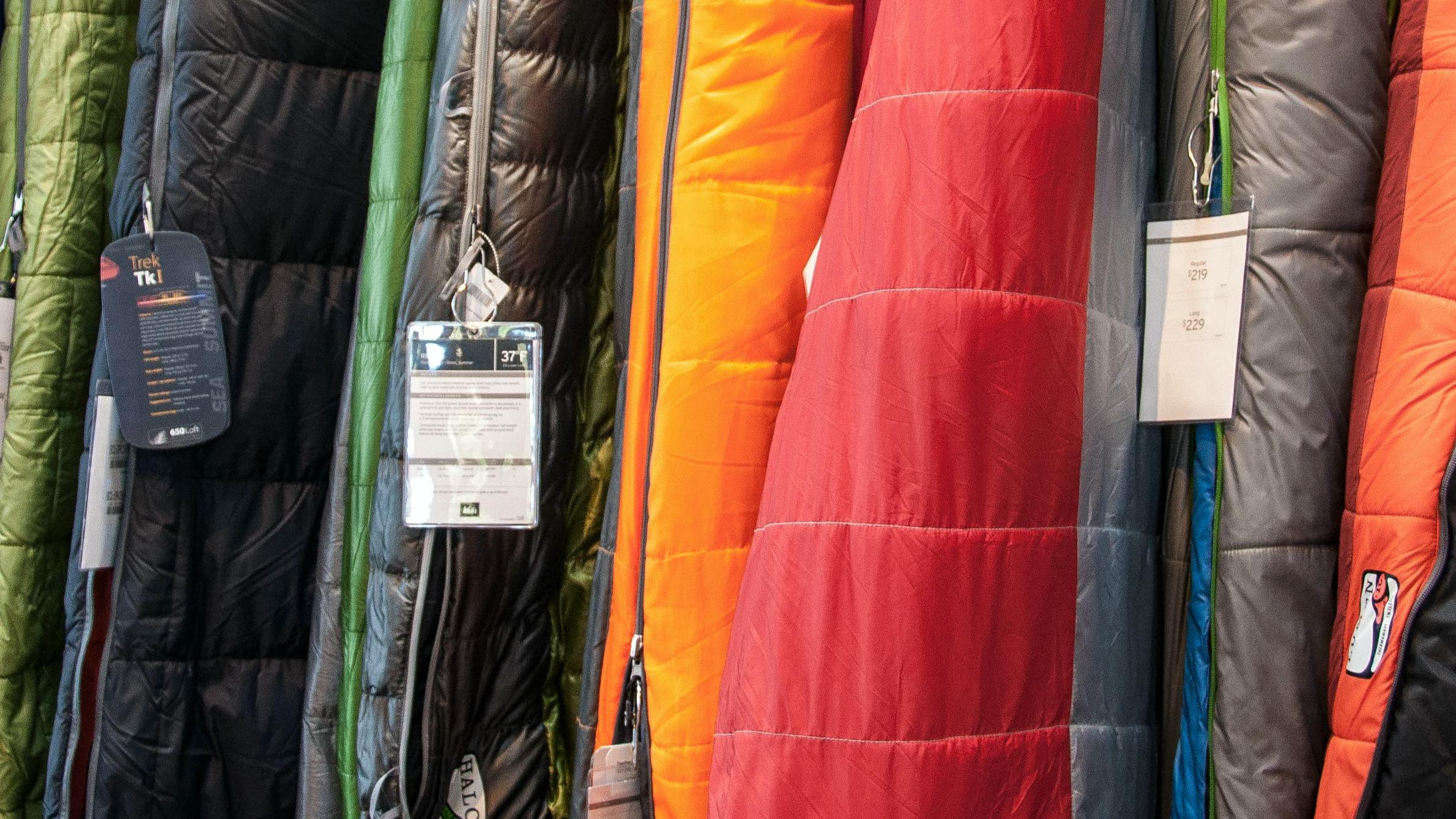 Several sleeping bags hanging together. 