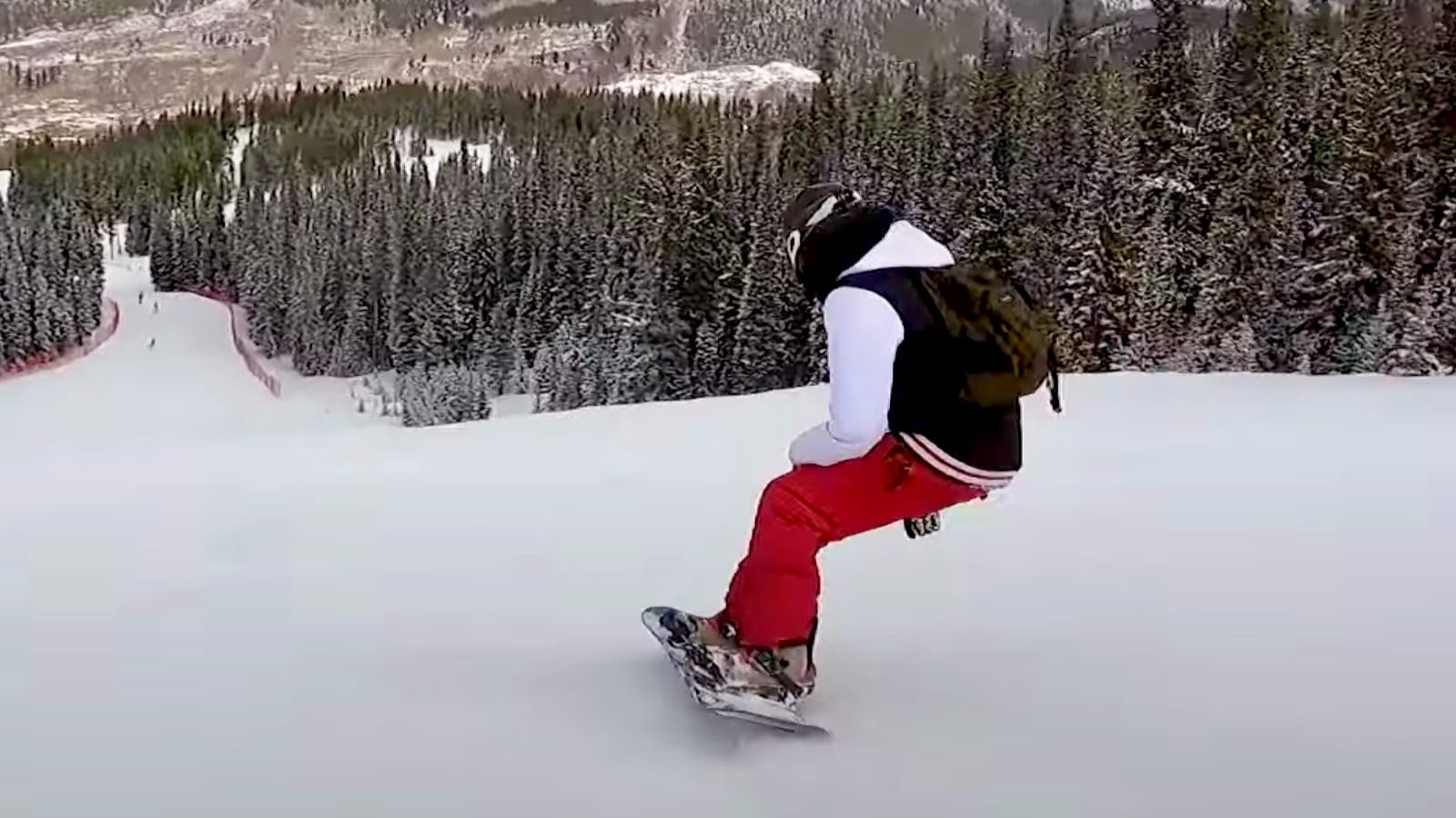 A screenshot from the YouTube video shows Frankie V. heading downhill on the board while wearing red pants. 