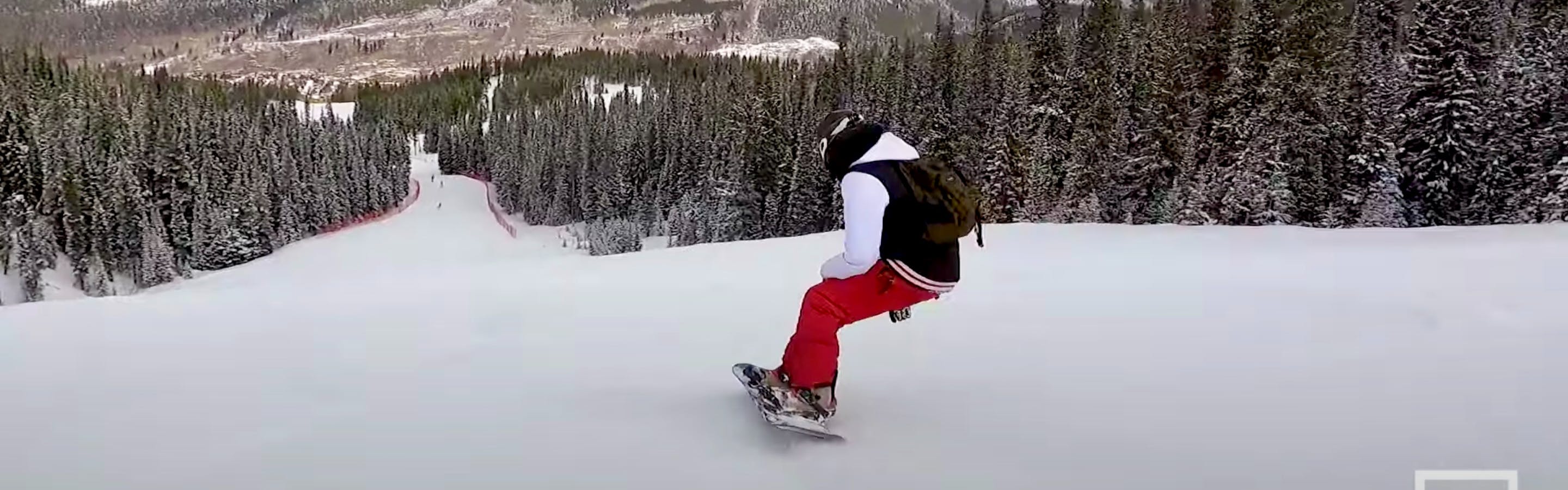 A screenshot from the YouTube video shows Frankie V. heading downhill on the board while wearing red pants. 