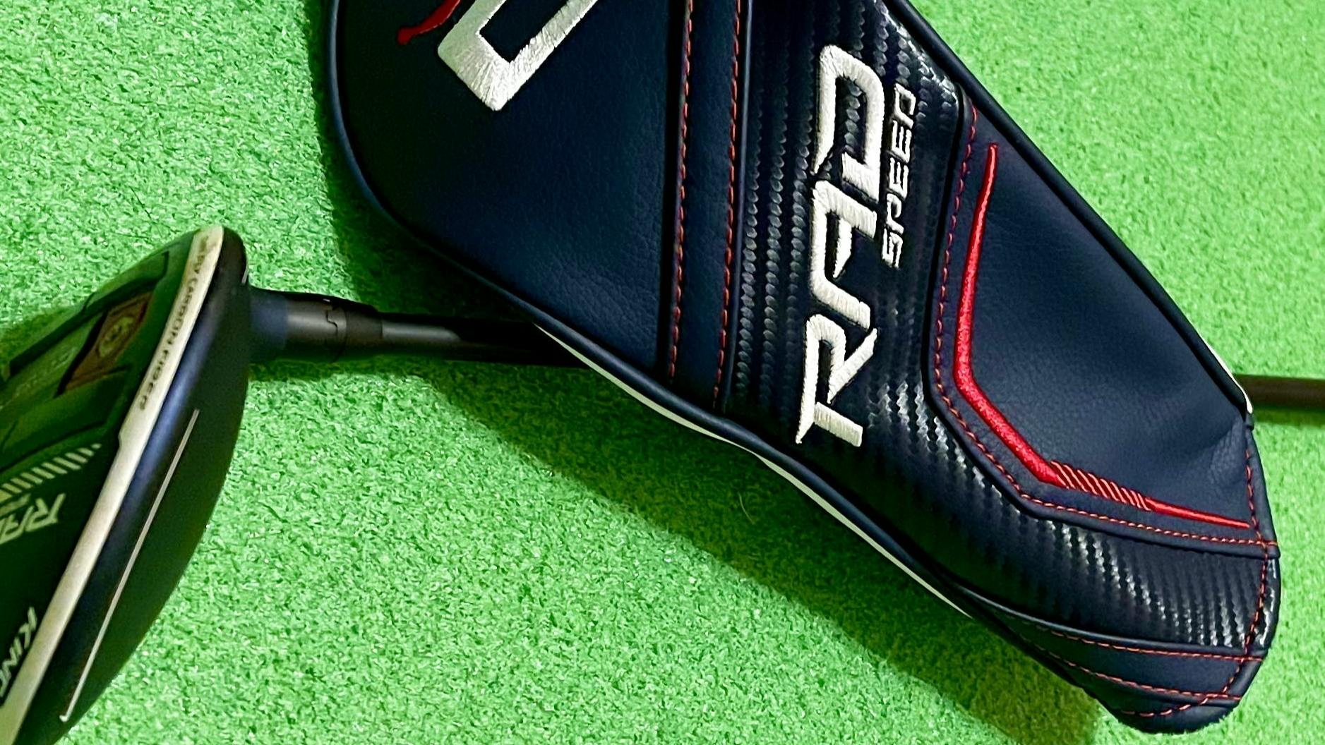 RadSpeed fairway wood and head cover lying on a turf.