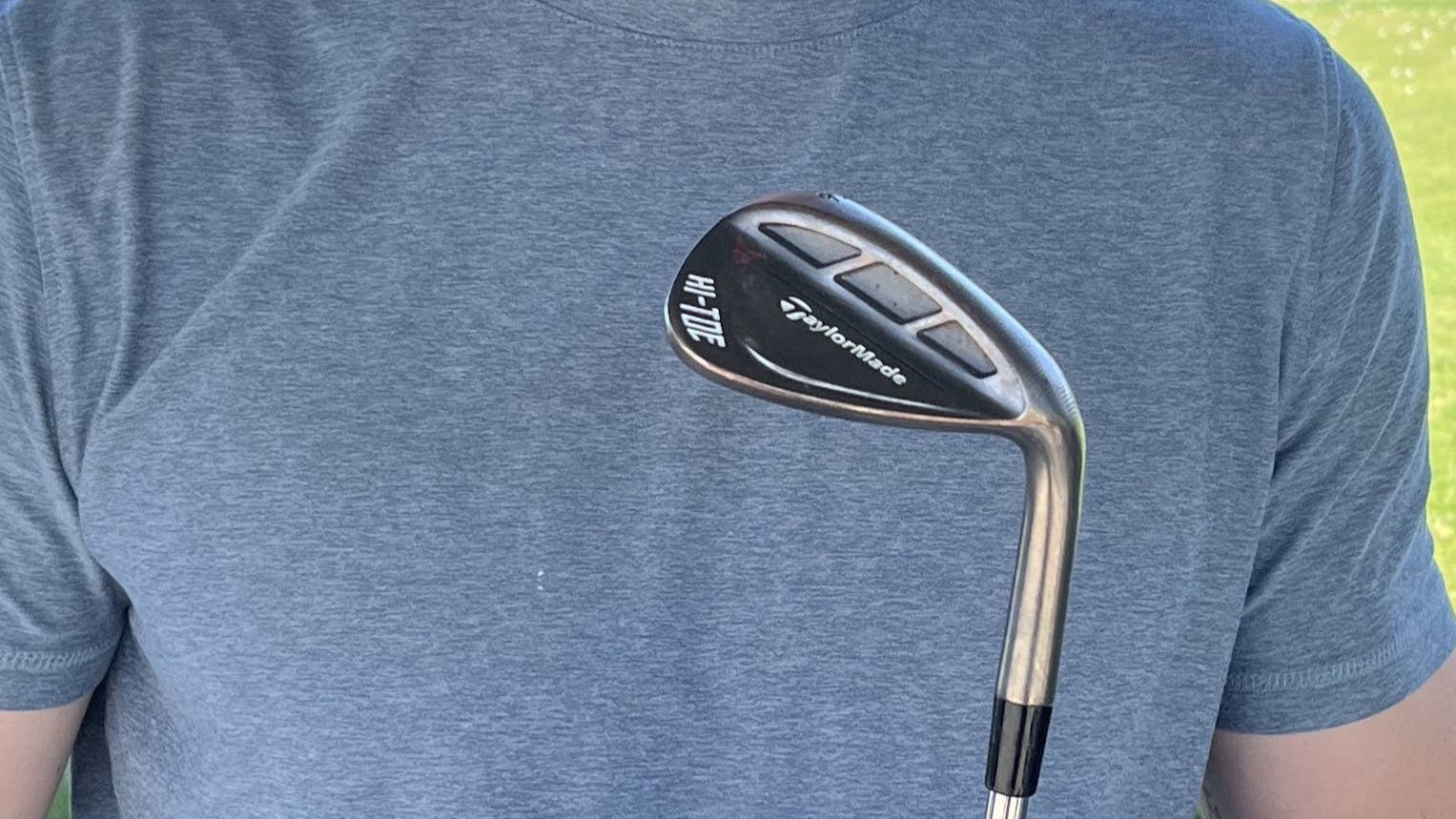 Man holds the TaylorMade MG Hi-Toe RAW Wedge.