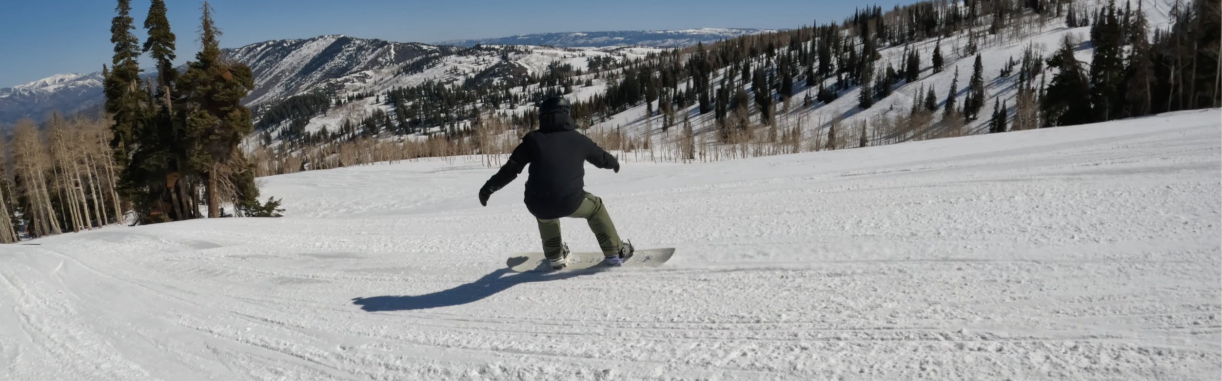 A snowboarder on the 2023 Ride Algorythm Snowboard.