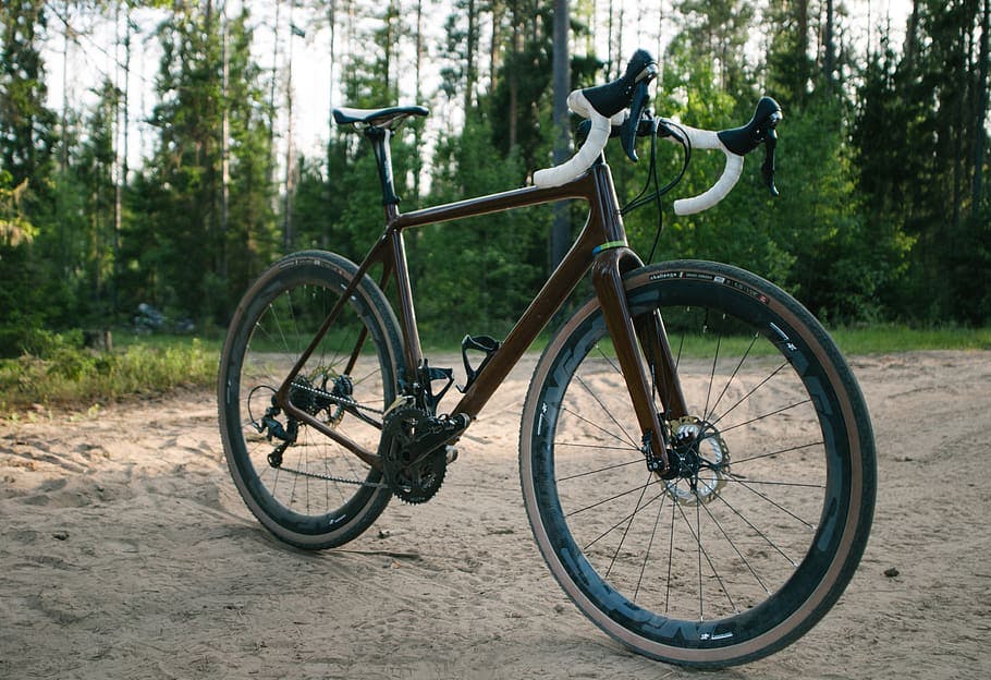A gravel bike standing in the sand.