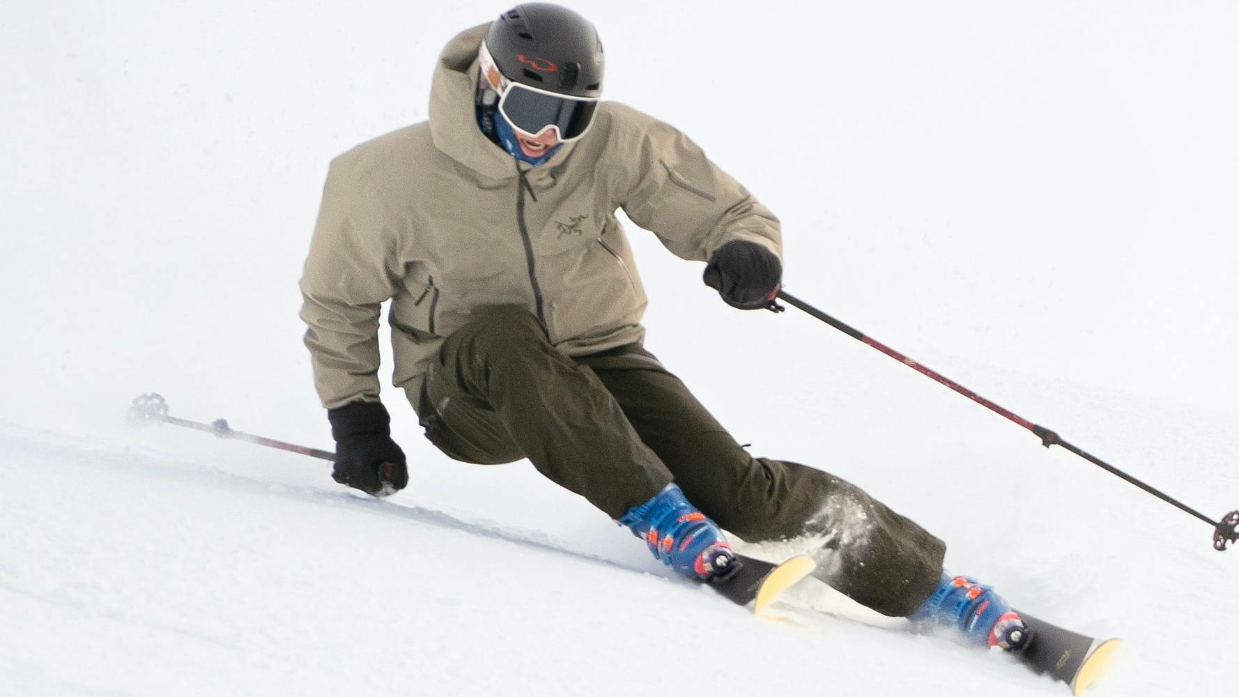 A skier carving down a ski hill. 