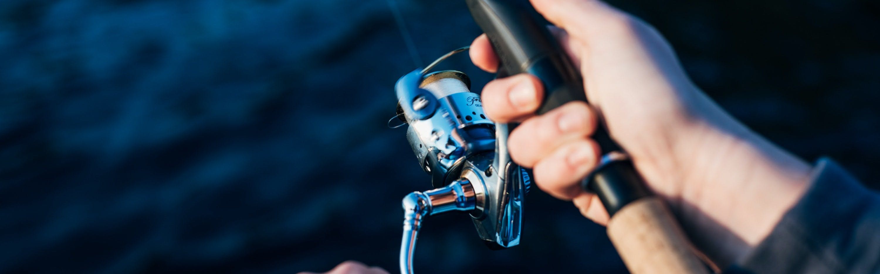 Premium Photo  Close up of spinning with the fishing reel in the