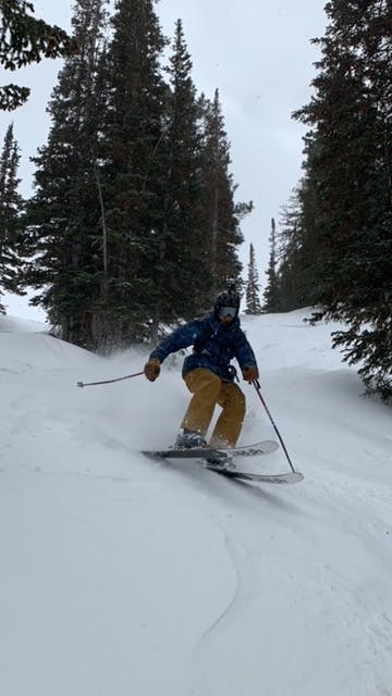 A skier skiing in the K2 Mindbender 100 Ski Boots · 2022. 
