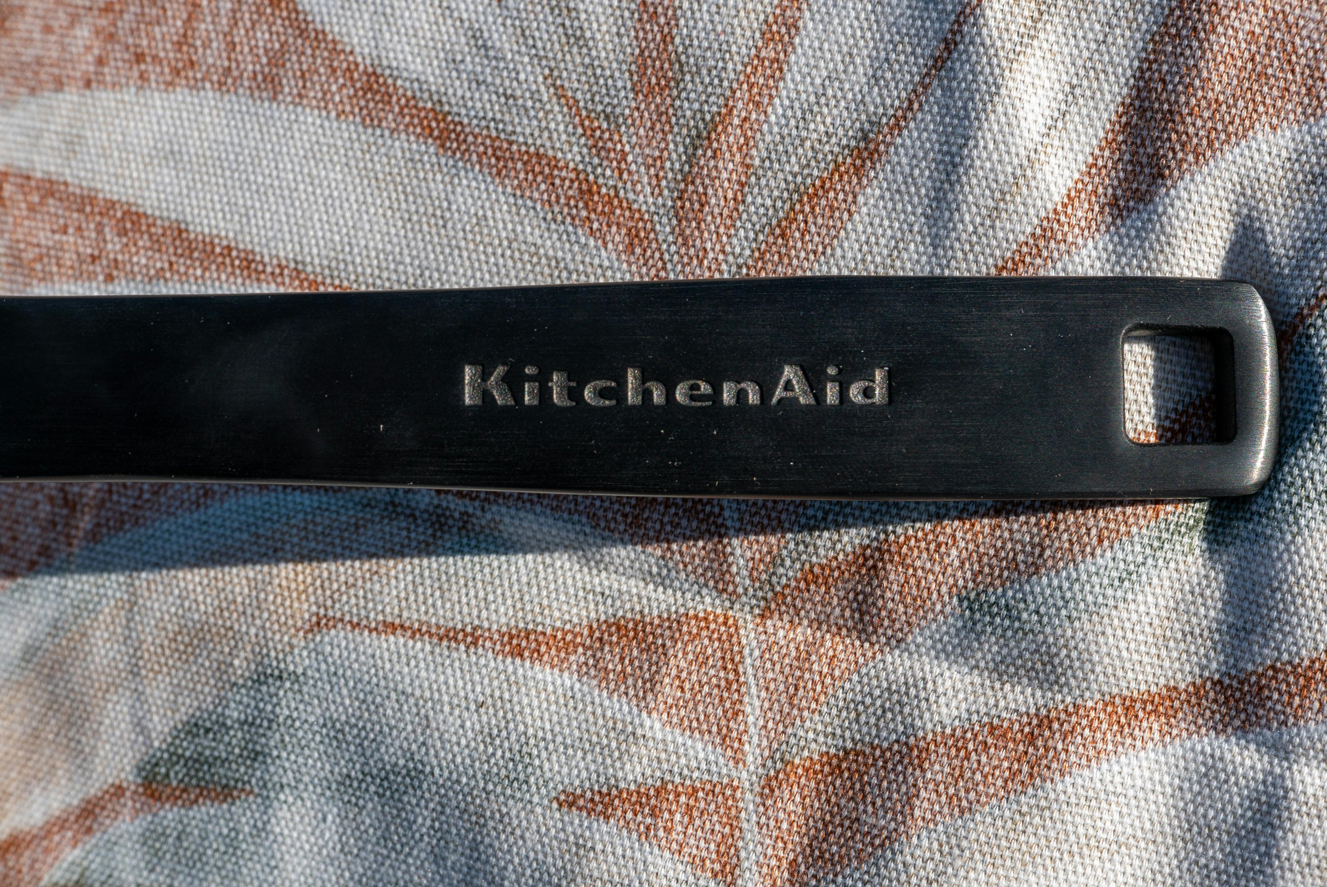 The loop for handing the KitchenAid 5-Ply Clad Stainless Steel Induction Frying Pan, 10-Inch, Polished Stainless Steel.