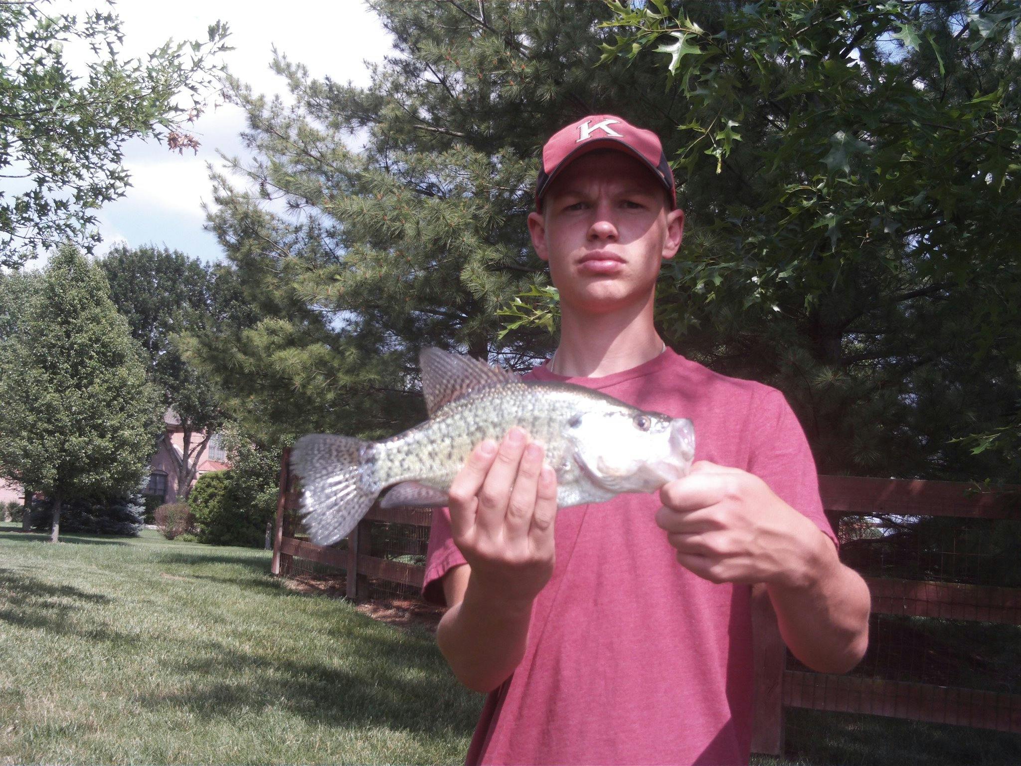 The author as a young man holds up a crappie.