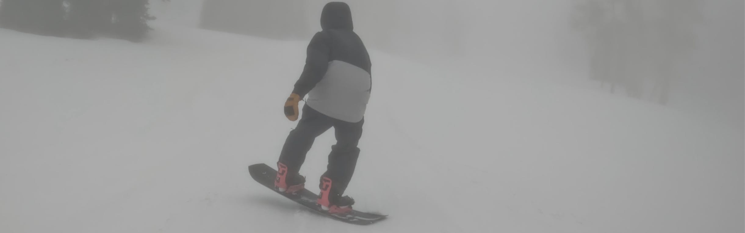 A snowboarder on the  2023 Ride Superpig Snowboard.