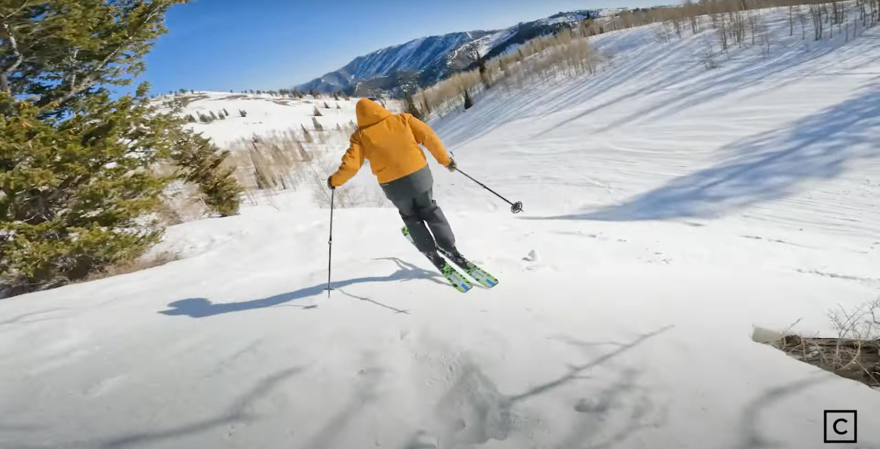 A skier jumping off a jump on skis. 