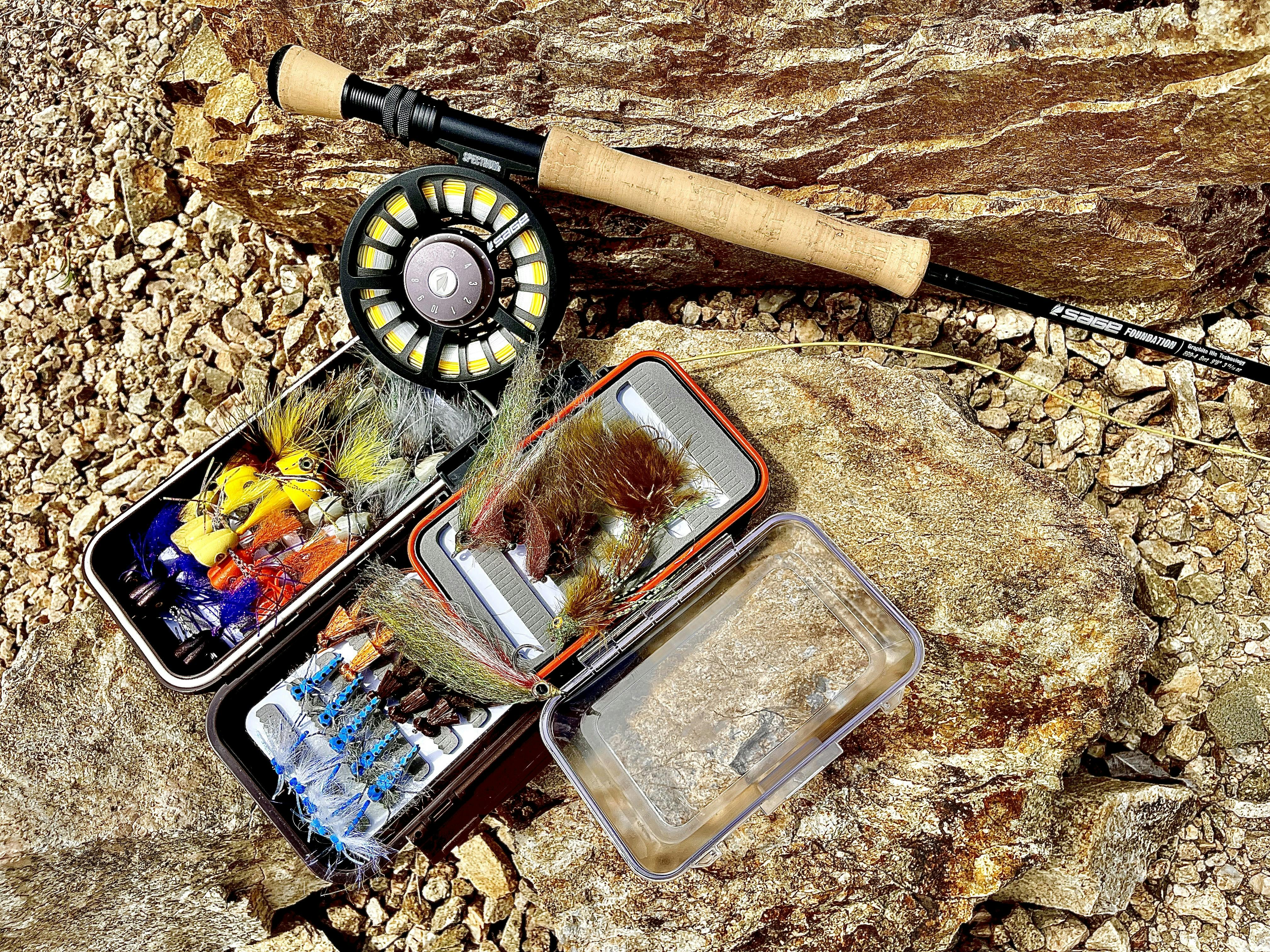A box of flies and the Sage Foundation Fly Rod.