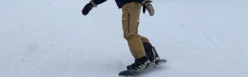 A snowboarder on the Arbor Spruce Snowboard Bindings 