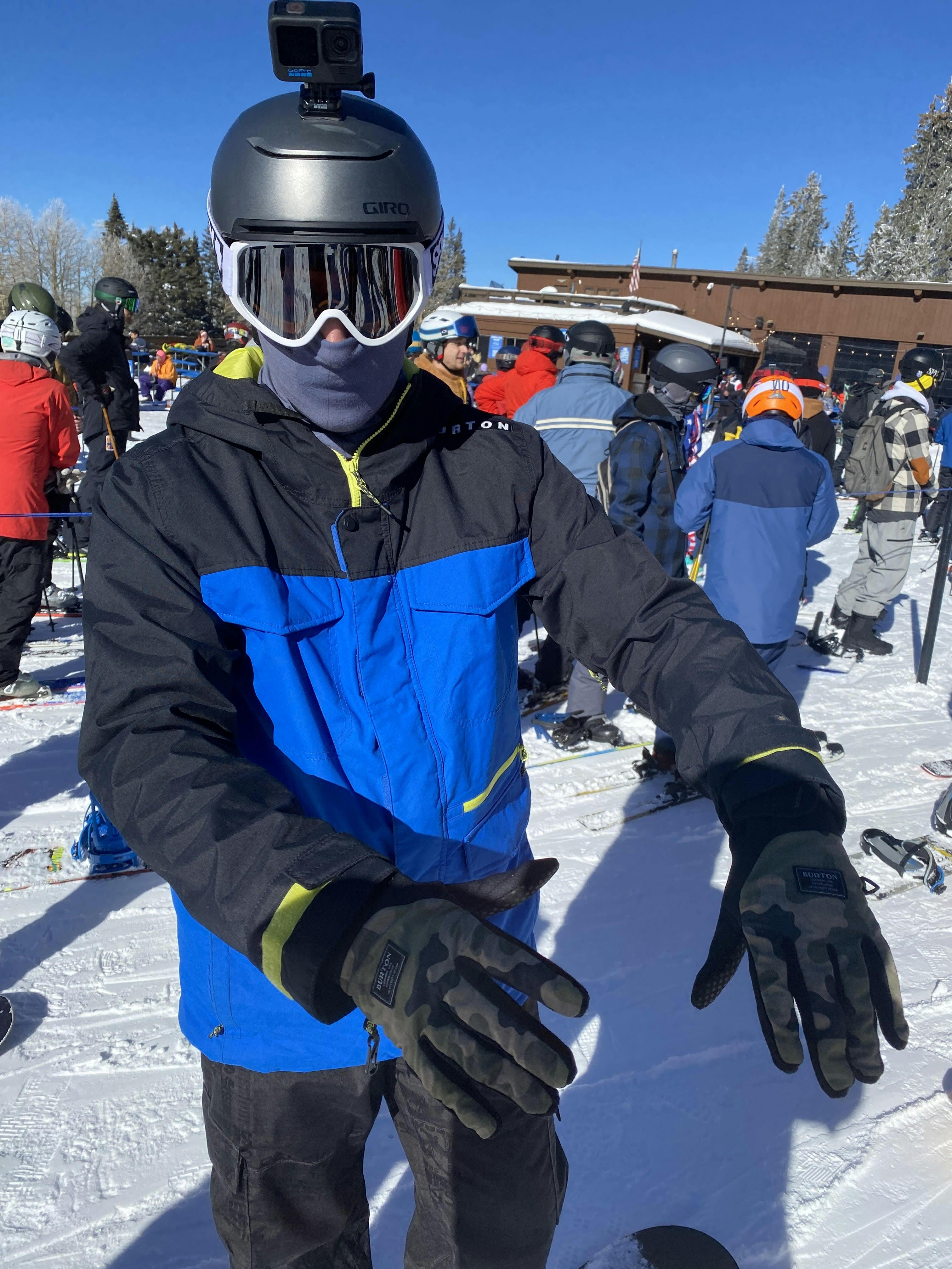 A snowboarder with the Burton Park gloves on.