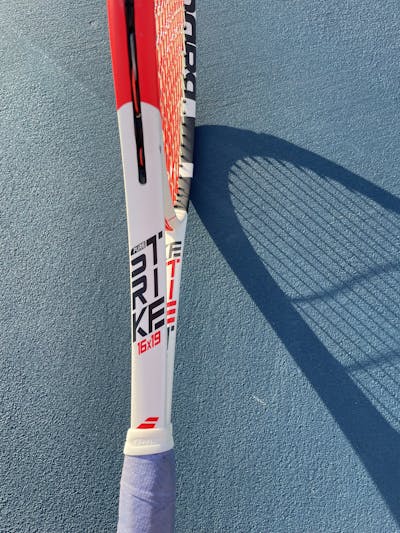 Side details of the Babolat Pure Strike 16x19 Racquet.