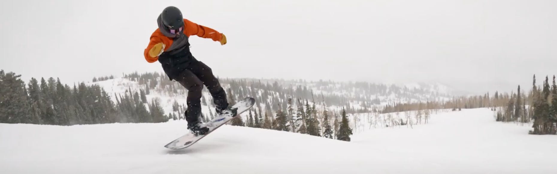 Curated Snowboard Expert Victor Von Claus jumping with the 2023 Ride Shadowban snowboard