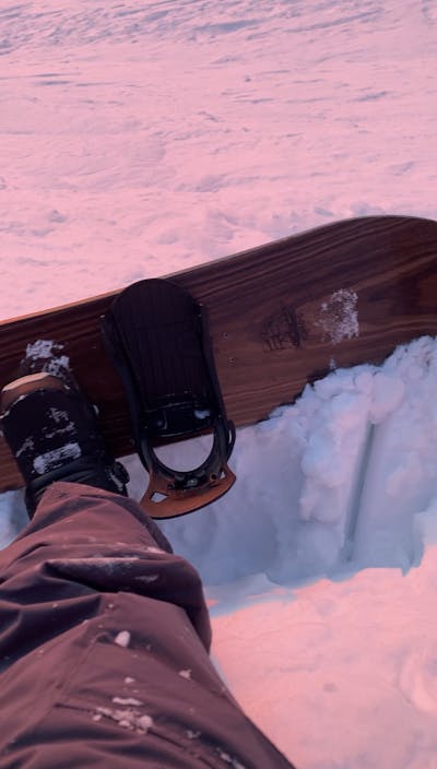 The Burton Step On Re:Flex Snowboard Bindings mounted to a snowboard. 