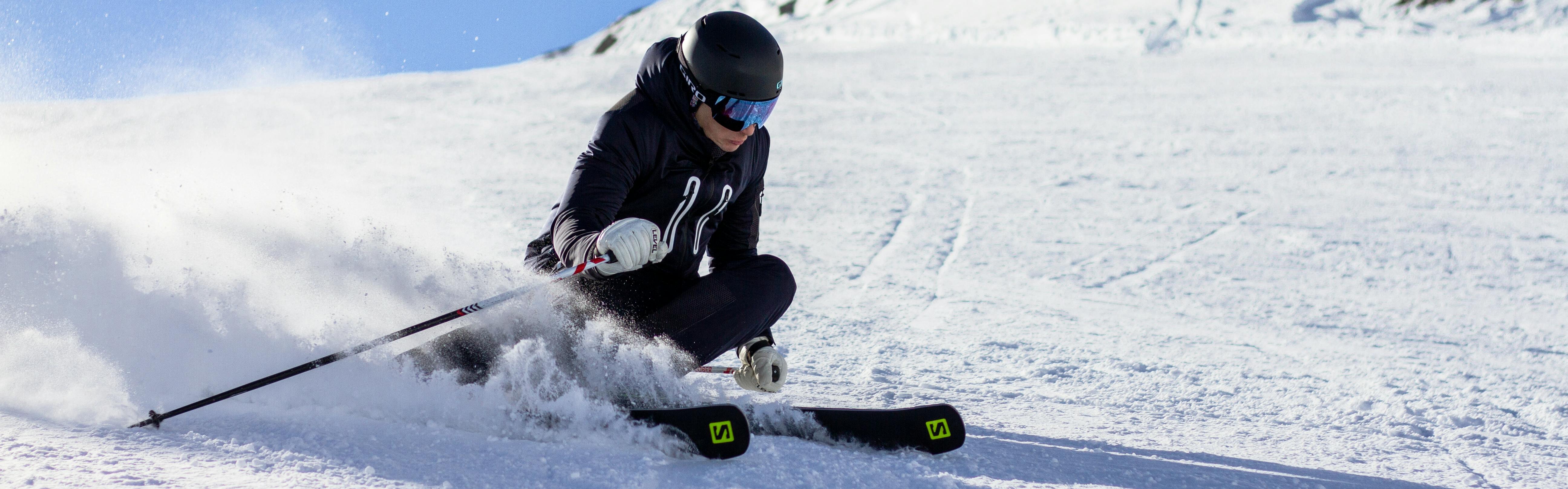 A skier carving down a slope. 