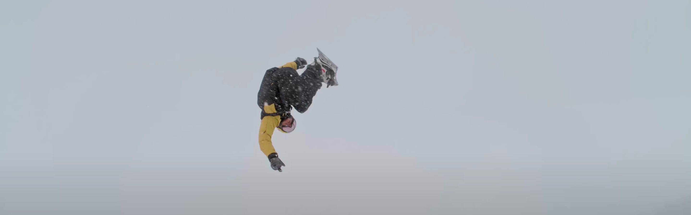 A screenshot from Jackson Hole Mountain Resort's YouTube page shows a snowboarder flipping midair. 