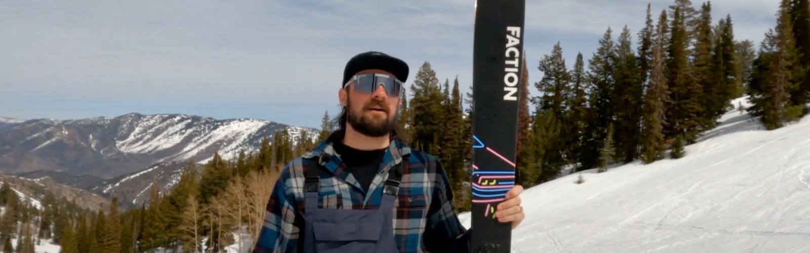 Ski Expert Hayden Wright standing with the 2023 Faction Prodigy 3.0 skis