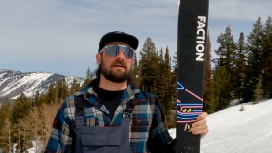 Ski Expert Hayden Wright standing with the 2023 Faction Prodigy 3.0 skis
