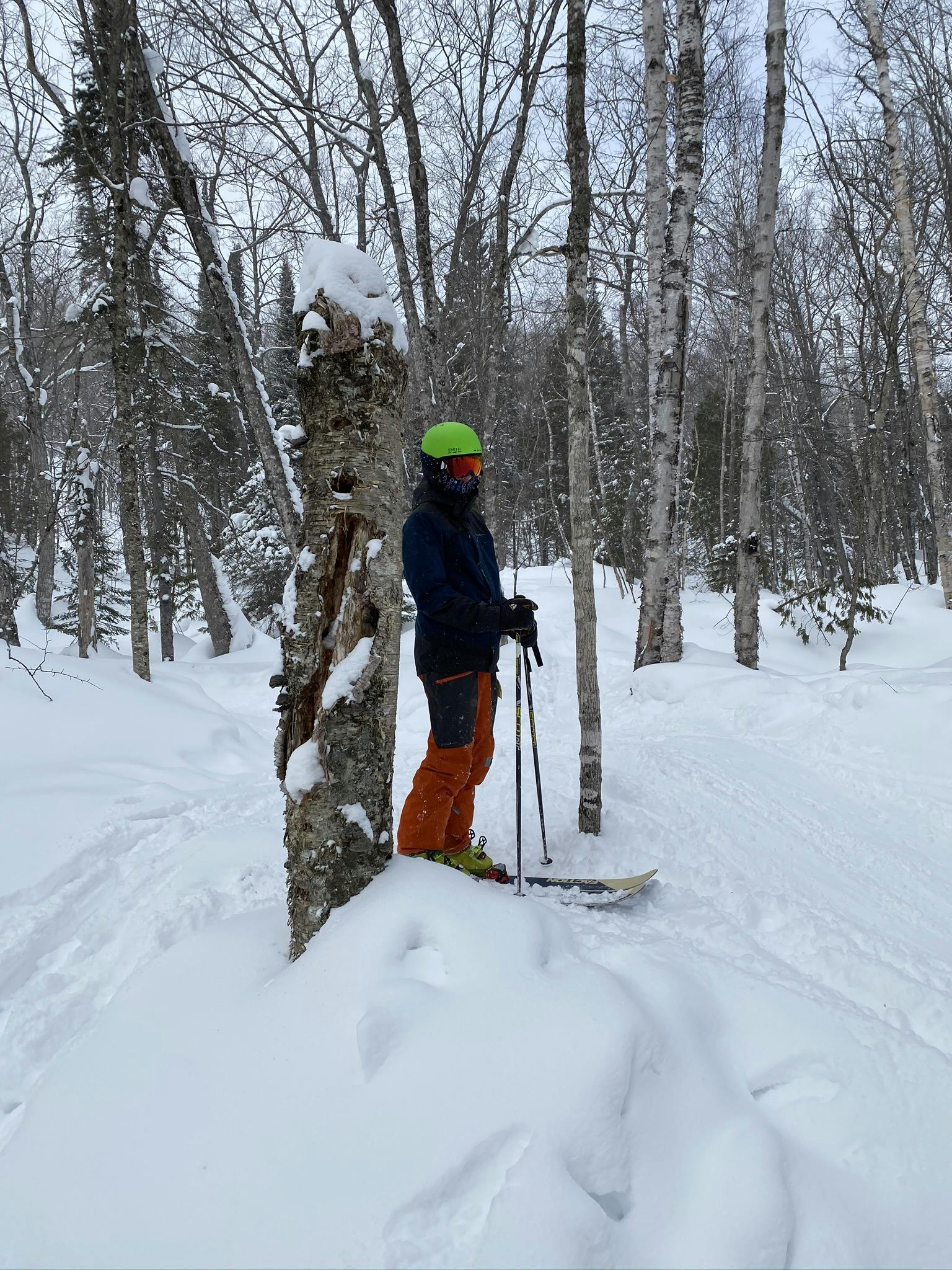 A skier standing on a snowy run with the Faction 1.0 CT skis. 