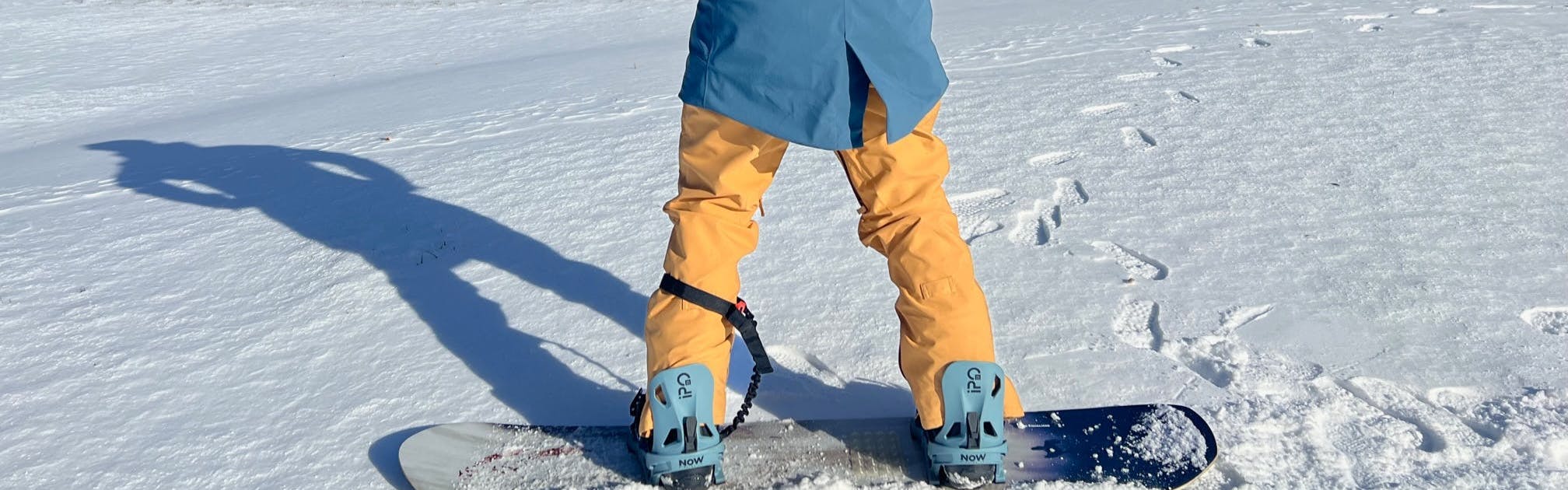 A snowboarder with the Now Ipo Snowboard Bindings