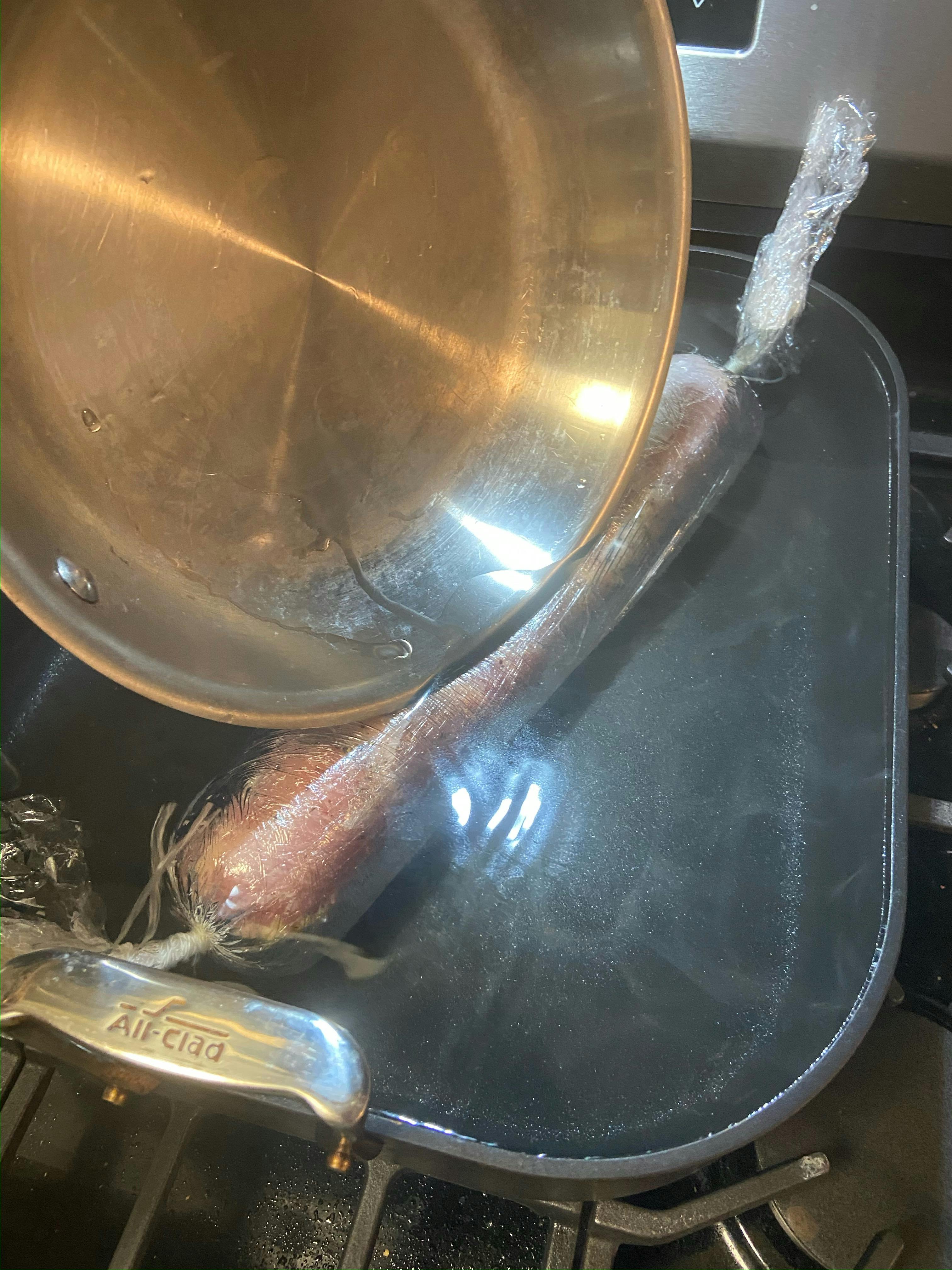 Poaching a turkey roulade in the HA1 Hard Anodized Nonstick, Roaster with Rack, 13x16 inches.