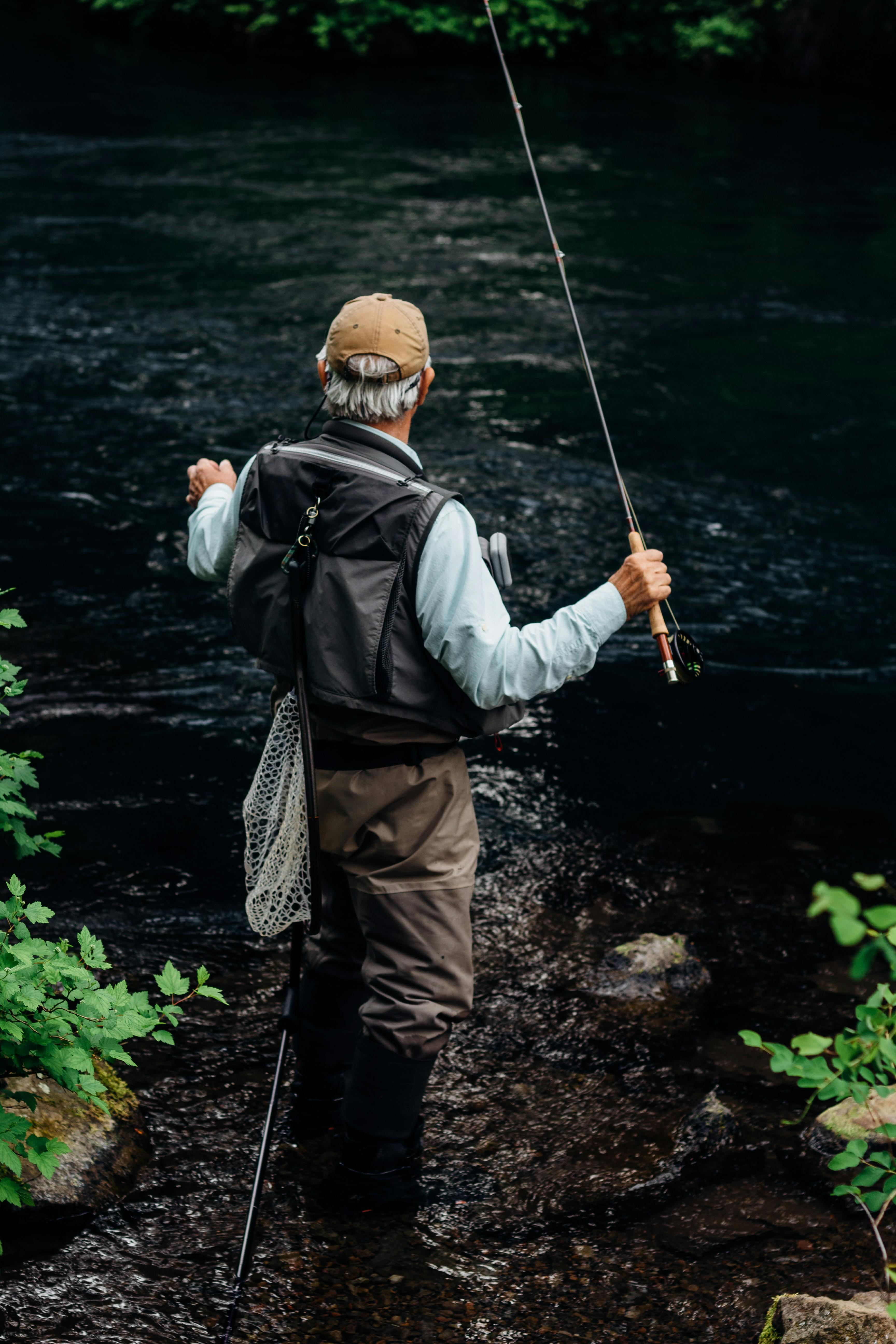 A fly fisherman standing in a river