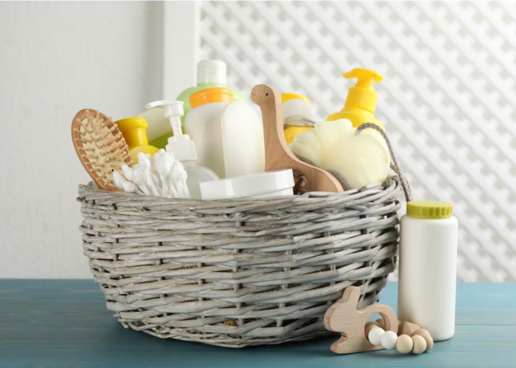 Baby bath time accessories in a basket
