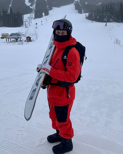 A snowboarder holding the Bataleon Goliath Snowboard.