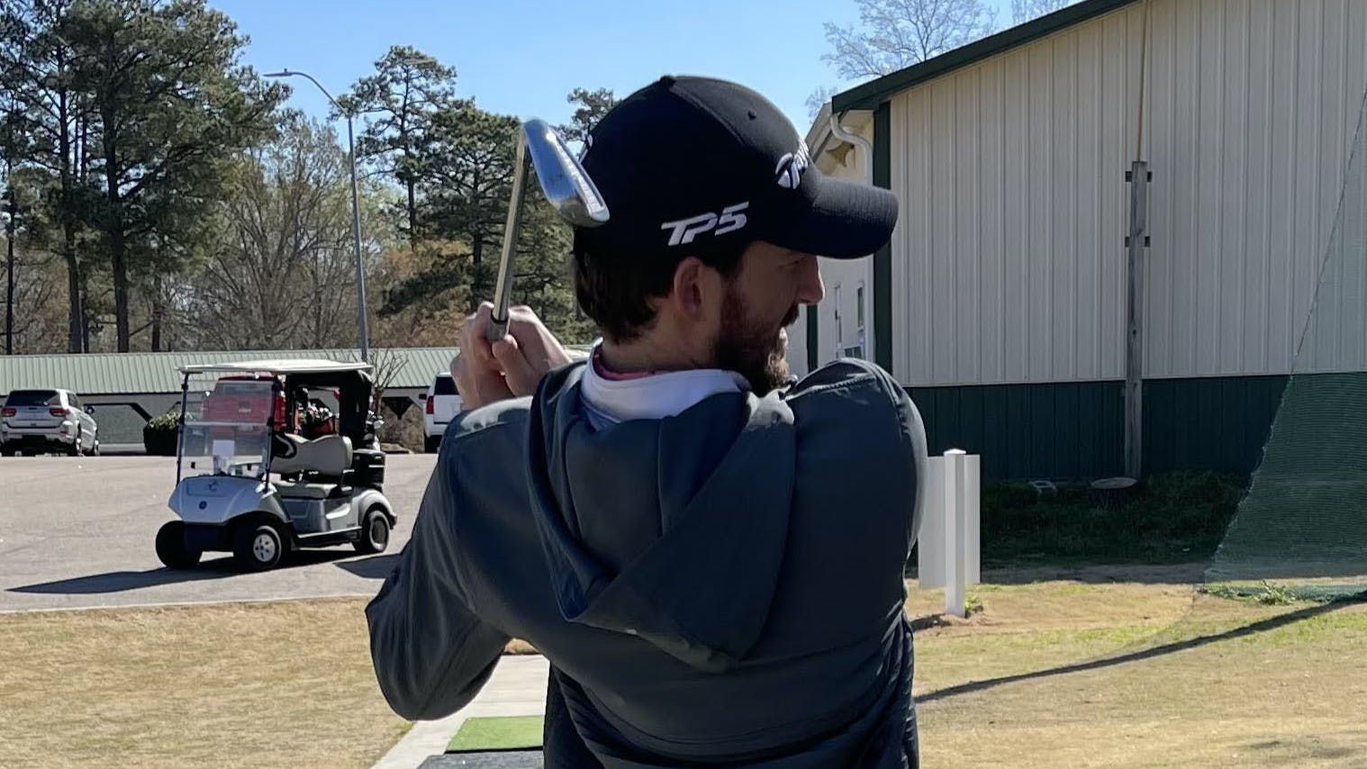 A golfer using the TaylorMade P760 Iron Set. 