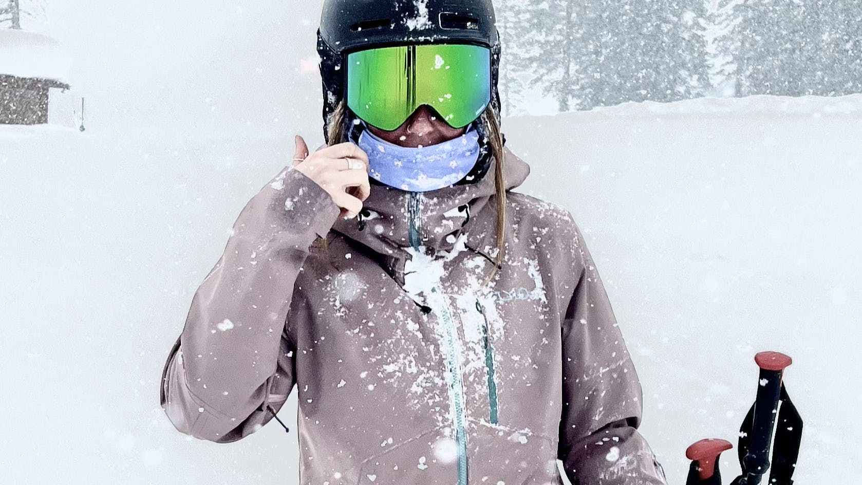 A skier in the Flylow Women's Sarah Insulated Jacket. 