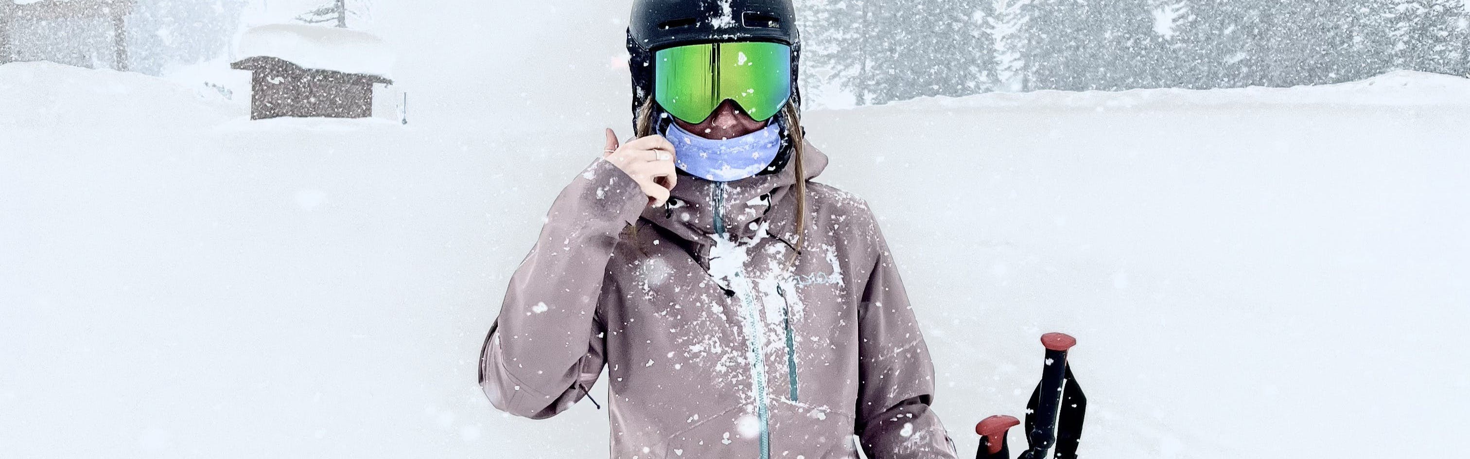 A skier in the Flylow Women's Sarah Insulated Jacket. 