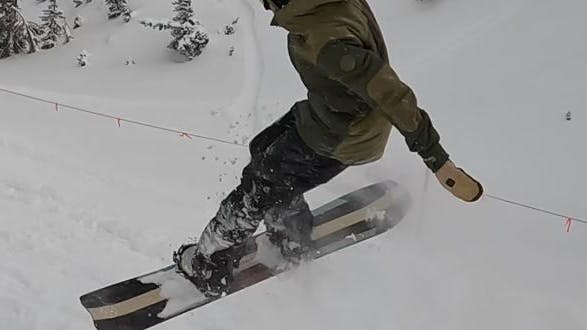 A snowboarder in the Burton Men's Covert Pants. 