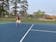 Tennis player on blue court