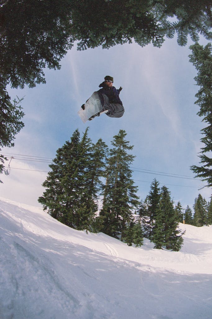 Jake Kuzyk grabs his board while in the air.