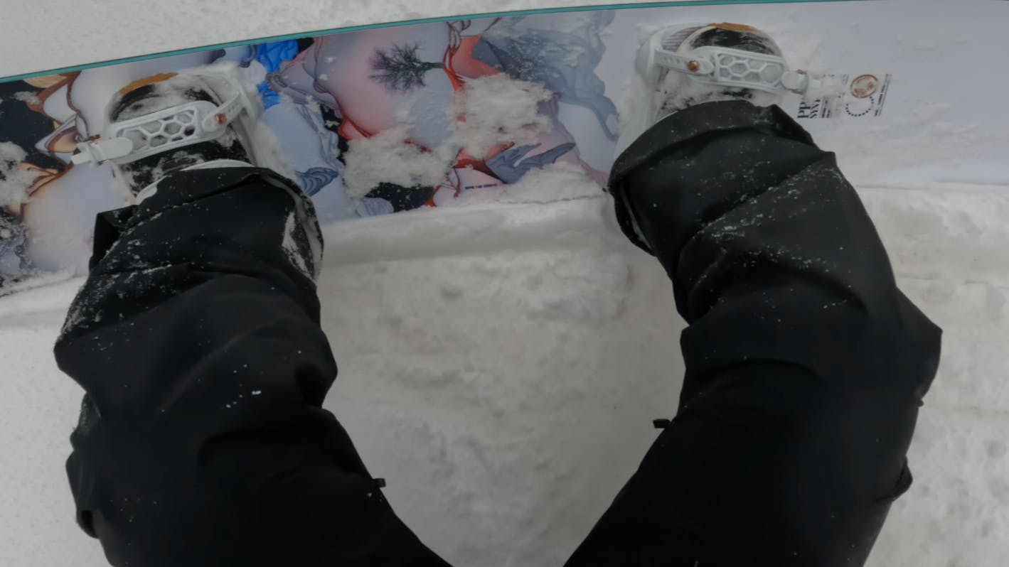 Top down view of the 2023 Never Summer Women's Proto Synthesis Snowboard. 