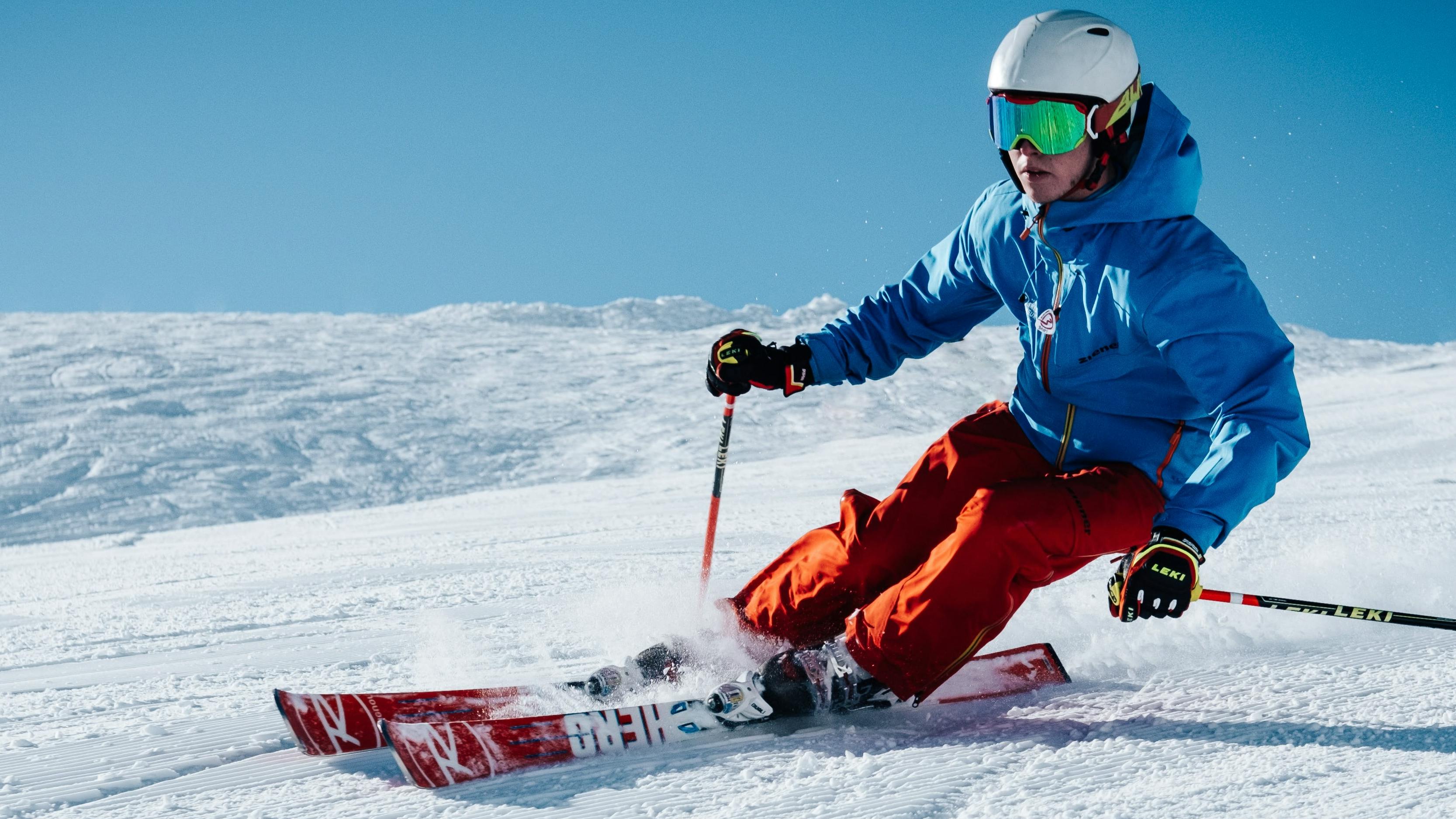 An expert skier arcing beautiful turn on Rossignol carving skis.  