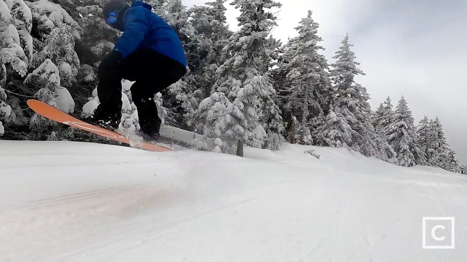 Curated expert Franco DiRienzo jumping through the air on the Never Summer Harpoon snowboard