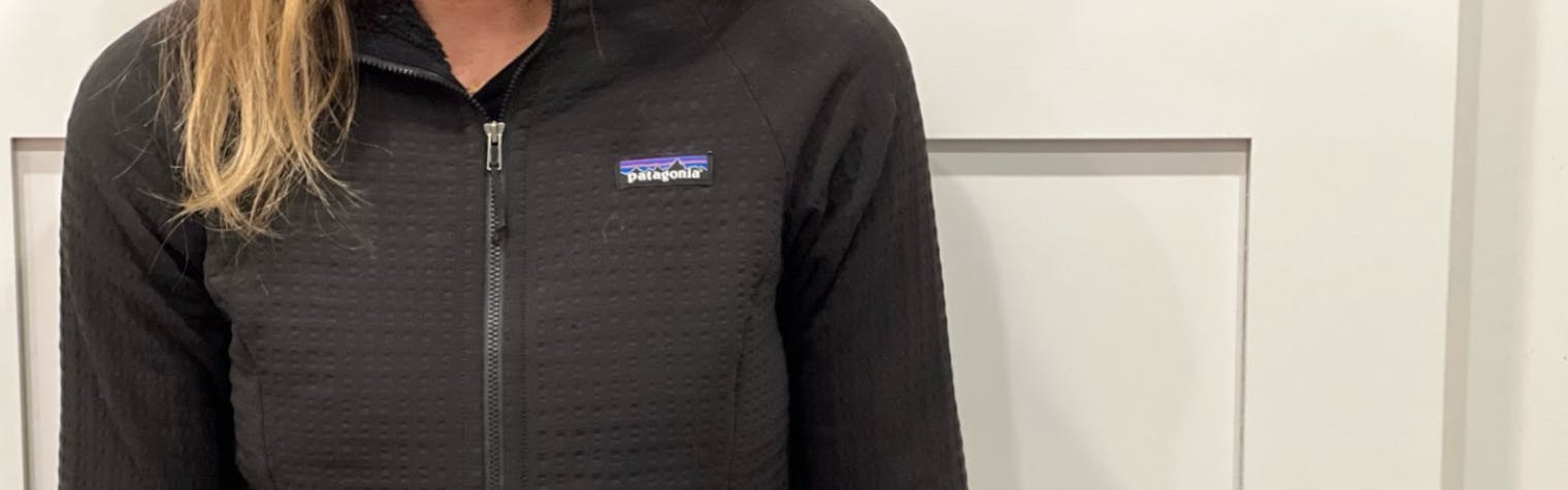 A woman wearing a Patagonia R2 Jacket. 