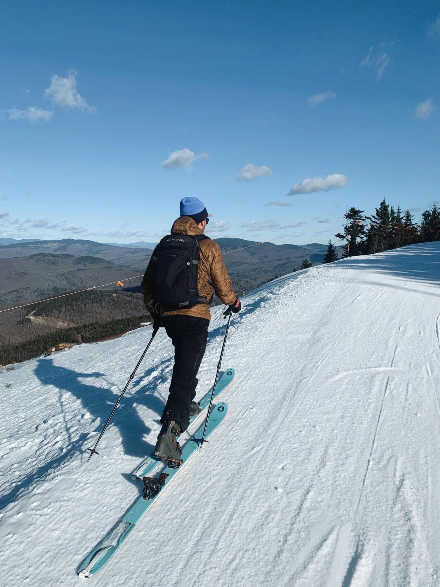 A person ski touring using the Tecnica Cochise 120 DYN Ski Boots.