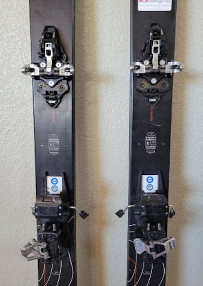 The Dynastar  M-Pro 84 Skis · 2021 with bindings mounted to them, 