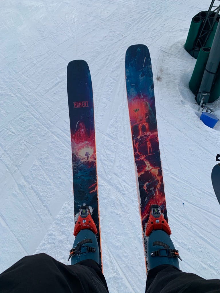 Photo of boots on skis from the point of view of Robbie M.