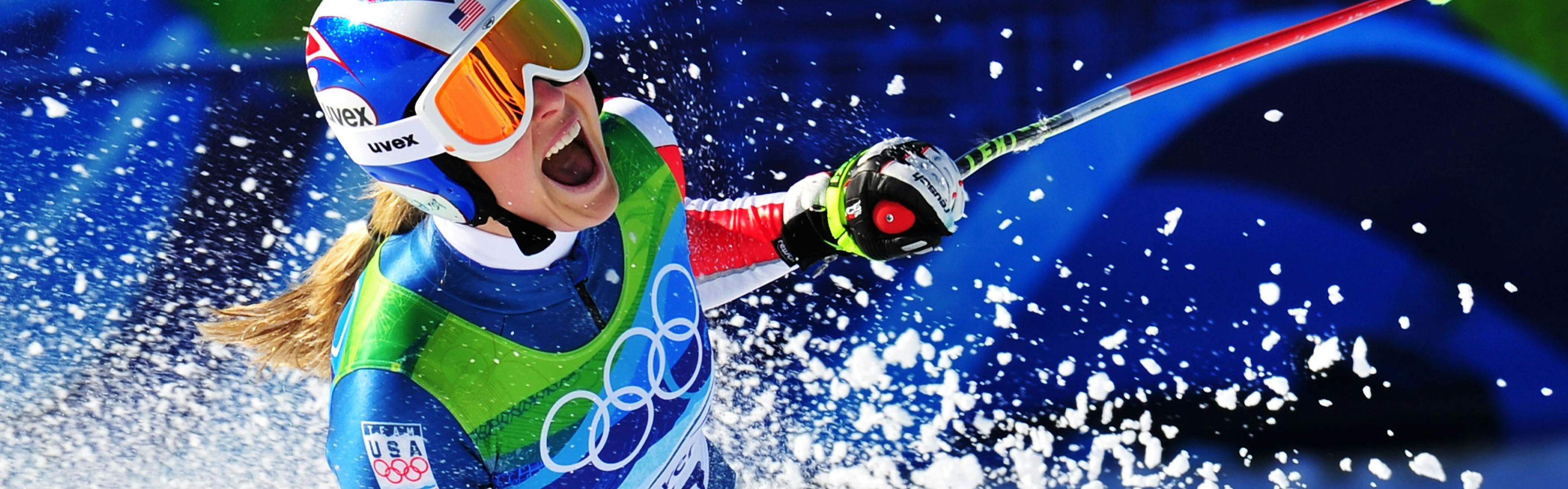 A skier celebrating after a run